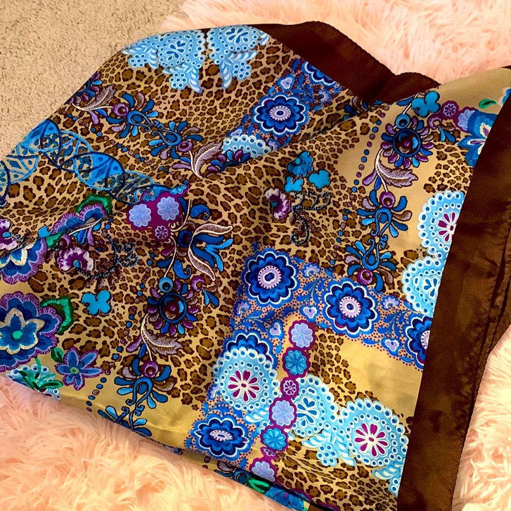Never worn! Gorgeous browns, magenta , green, teals leopard and floral scarf.